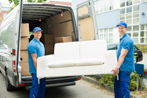 Removal van and moving boxes in a Harrow residential street
