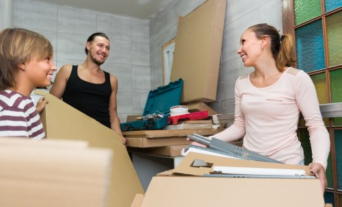 Moving van and packed boxes for a home move in Harrow