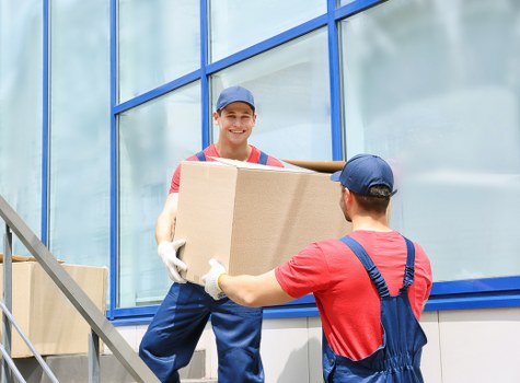 Packed boxes and furniture ready for transport on moving day