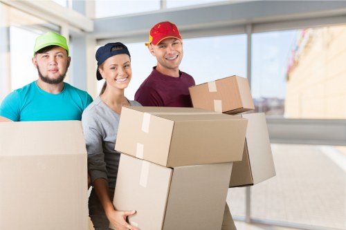 Packing and loading household furniture into a removals van