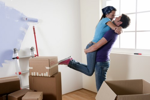 Local house removal preparation with labelled boxes and furniture protection