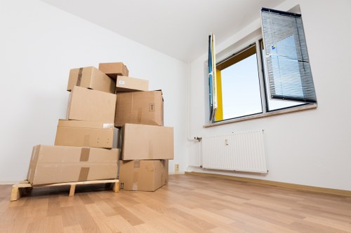 Removal crew unloading belongings at a Harrow property