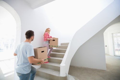 Professional movers handling furniture for a flat move in Harrow