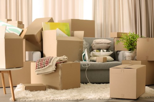 Careful loading of household items into a moving van for a Harrow property