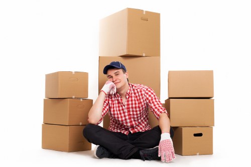 Professional movers handling desks and office furniture